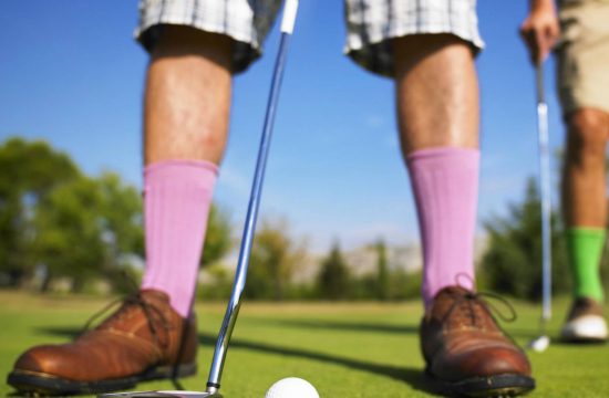 Man takes a putt at one a golf resorts a Coffs Harbour attraction near Diggers Beach Cottage