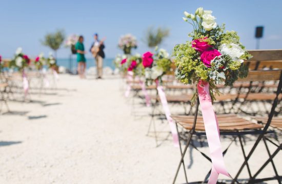 Wedding guests seating on a beach