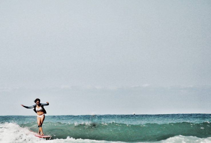Woman Surfing Diggers Beach